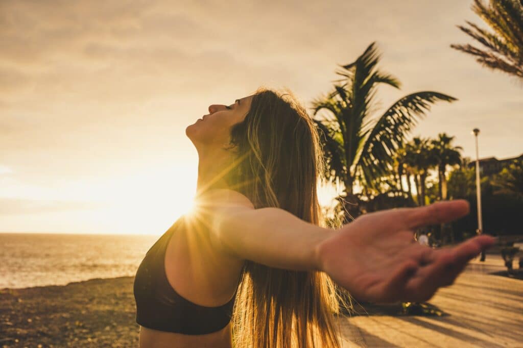 Athlete sporty and beautiful young woman stretch and breathe